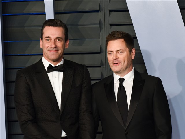 When Megan Mullally was doing her solo shots, her husband Nick Offerman and Jon Hamm held hands behind her.