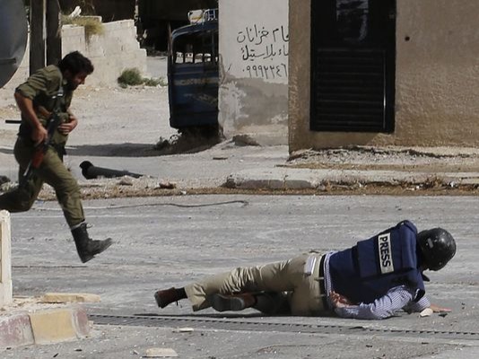 A humble reporter forced to go into the middle of a dangerous warzone just to get the best shots. Wearing a «press» logo on the chest and ...