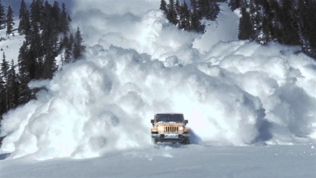 An avalanche is a geophysical hazard involving a slide of a large snow or rock mass down a mountainside, caused when a buildup of material is released...