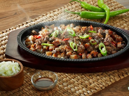 Sisig is a Filipino dish made from parts of pig head and liver, usually seasoned with calamansi and chili pepp...