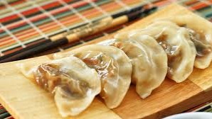 Dumpling is a broad classification for a dish that consists of pieces of dough (made from a variety of starch sources) wrapped around a filling or of ...